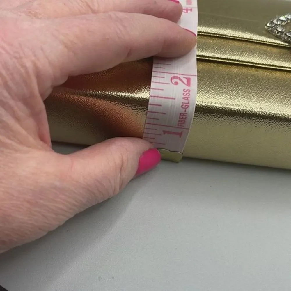 Vintage faux leather gold clutch the rhinestone closure.
